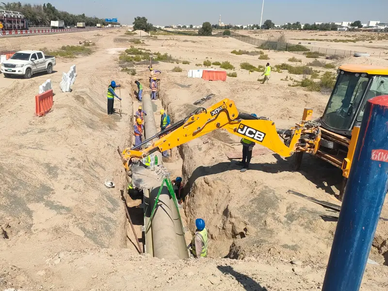 Excavation and underground pipeline installation works using excavator machinery by Osool AlRoyah General Contracting in the UAE